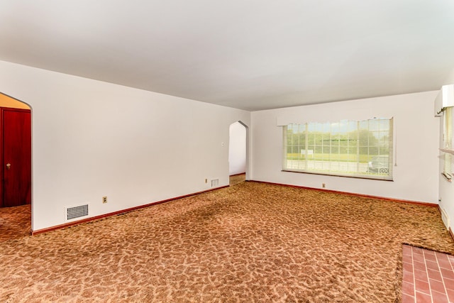 39 Buttermilk Pike, Fort Mitchell, KY 41017 - carpeted empty room featuring arched walkways and baseboards