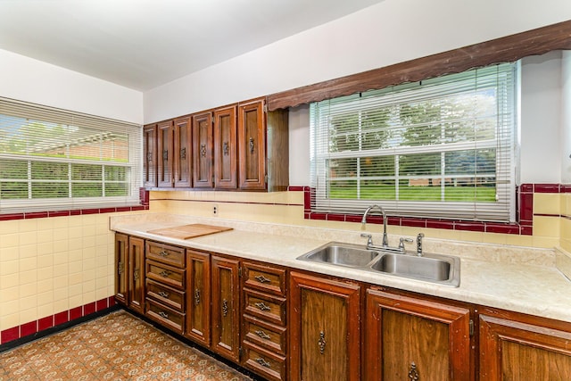 39 Buttermilk Pike, Fort Mitchell, KY 41017 - kitchen with a sink, healthy amount of natural light, light countertops, and tile walls