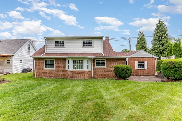 39 Buttermilk Pike, Fort Mitchell, KY 41017 - rear view of property with brick siding, a yard, roof with shingles, and a patio
