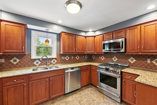 17 Harrison Ave, Bellevue, KY 41073 - kitchen with appliances with stainless steel finishes, a sink, light stone countertops, decorative light fixtures, and backsplash