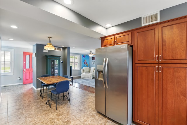 17 Harrison Ave, Bellevue, KY 41073 - kitchen featuring stainless steel fridge, baseboards, brown cabinets, recessed lighting, and hanging light fixtures