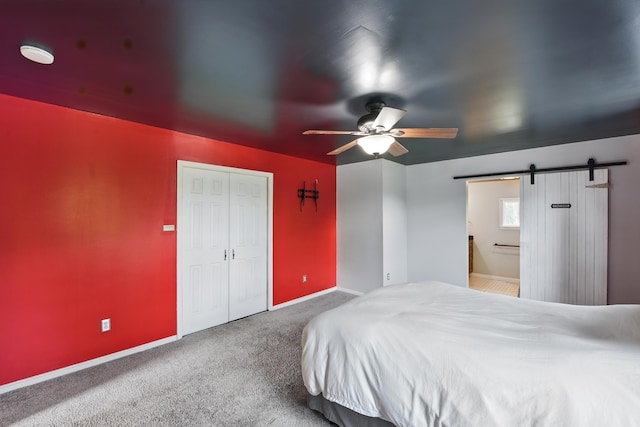 17 Harrison Ave, Bellevue, KY 41073 - bedroom with a barn door, carpet floors, baseboards, and a ceiling fan
