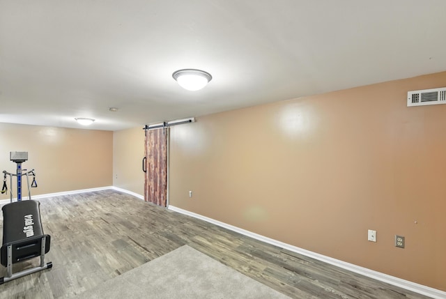 17 Harrison Ave, Bellevue, KY 41073 - finished basement featuring wood finished floors, baseboards, and a barn door