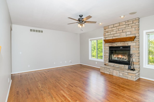 1169 Appomattox Dr, Florence, KY 41042 - unfurnished living room with a fireplace, baseboards, wood finished floors, and a ceiling fan