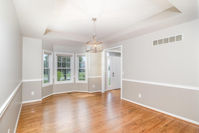 1169 Appomattox Dr, Florence, KY 41042 - unfurnished room with a chandelier, baseboards, and light wood-style flooring