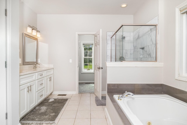 1169 Appomattox Dr, Florence, KY 41042 - full bath featuring a whirlpool tub, vanity, a stall shower, tile patterned flooring, and baseboards
