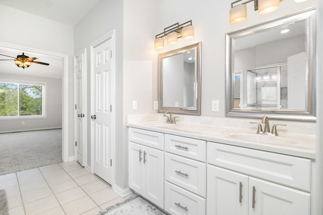 1169 Appomattox Dr, Florence, KY 41042 - bathroom featuring double vanity, a shower with door, tile patterned floors, baseboards, and a ceiling fan