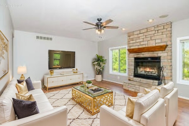 1169 Appomattox Dr, Florence, KY 41042 - living room featuring ceiling fan, a large fireplace, baseboards, and wood finished floors