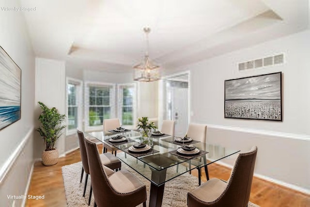 1169 Appomattox Dr, Florence, KY 41042 - dining area featuring a chandelier, baseboards, and wood finished floors
