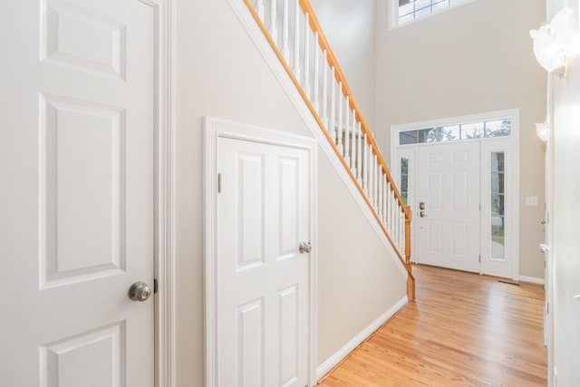 1169 Appomattox Dr, Florence, KY 41042 - foyer featuring a high ceiling, stairway, light wood-type flooring, and baseboards