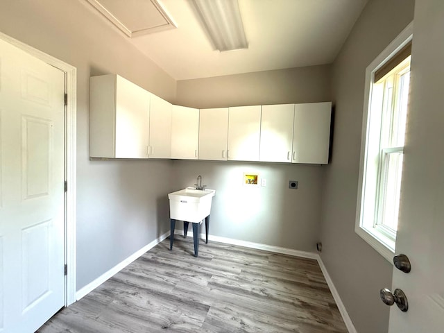 1169 Appomattox Dr, Florence, KY 41042 - laundry room featuring cabinet space, hookup for an electric dryer, light wood finished floors, washer hookup, and baseboards