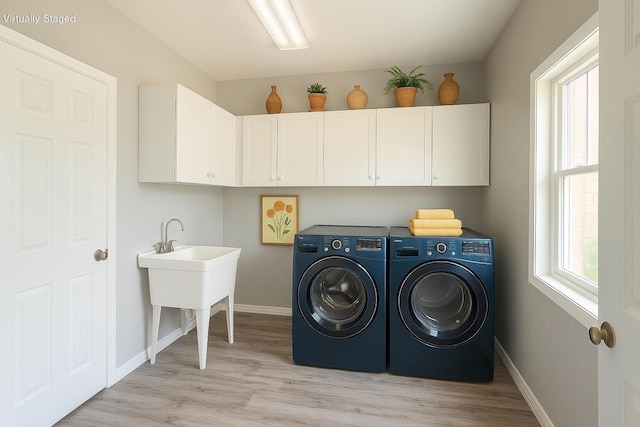 1169 Appomattox Dr, Florence, KY 41042 - laundry room featuring cabinet space, washing machine and clothes dryer, baseboards, and light wood-style floors