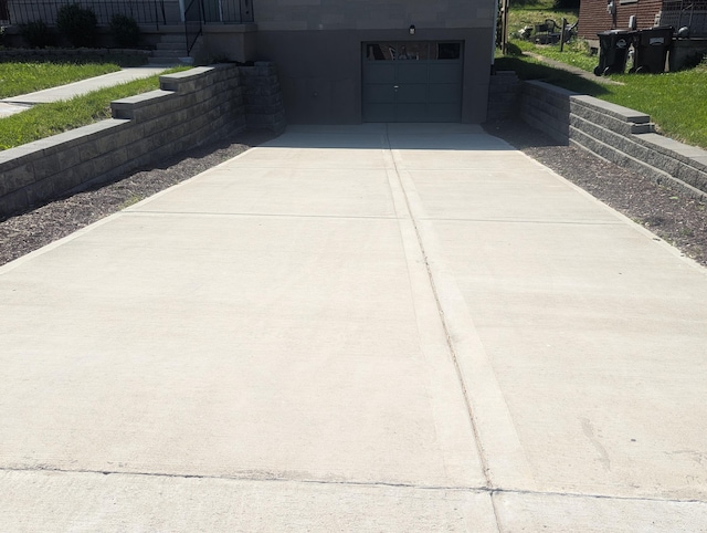 3157 Woodward St, Erlanger, KY 41018 - exterior space featuring driveway and a garage