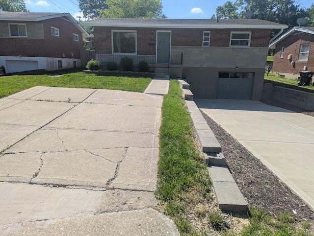 3157 Woodward St, Erlanger, KY 41018 - view of front of home with brick siding, concrete driveway, and a garage