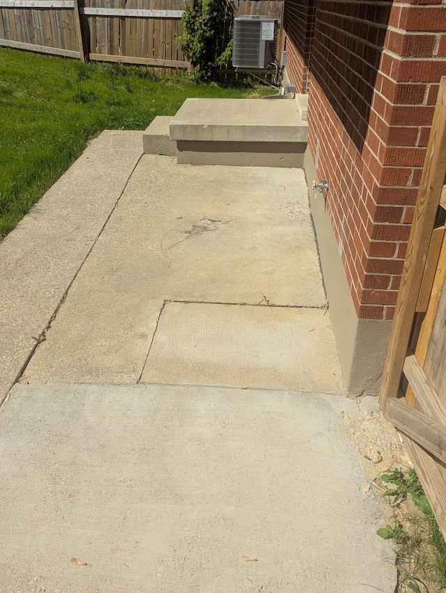 3157 Woodward St, Erlanger, KY 41018 - exterior view of central air condition unit, fence, and brick siding