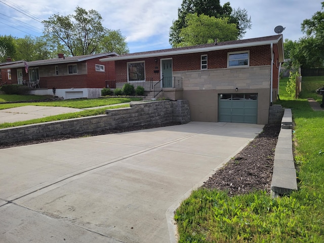 3157 Woodward St, Erlanger, KY 41018 - ranch-style home featuring a garage, driveway, stone siding, and brick siding