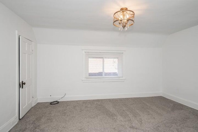 2730 Dakota Ave, Covington, KY 41015 - carpeted spare room featuring vaulted ceiling, a chandelier, and baseboards