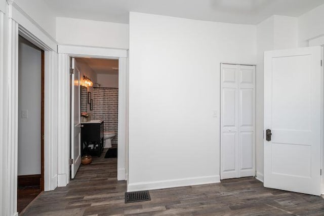 2730 Dakota Ave, Covington, KY 41015 - spare room with dark wood-type flooring and baseboards