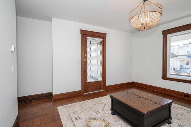2730 Dakota Ave, Covington, KY 41015 - living area with a chandelier, baseboards, and wood finished floors