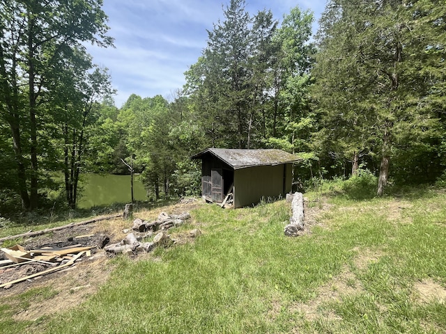247 Hideaway, Owenton, KY 40359 - view of yard featuring an outbuilding and a wooded view