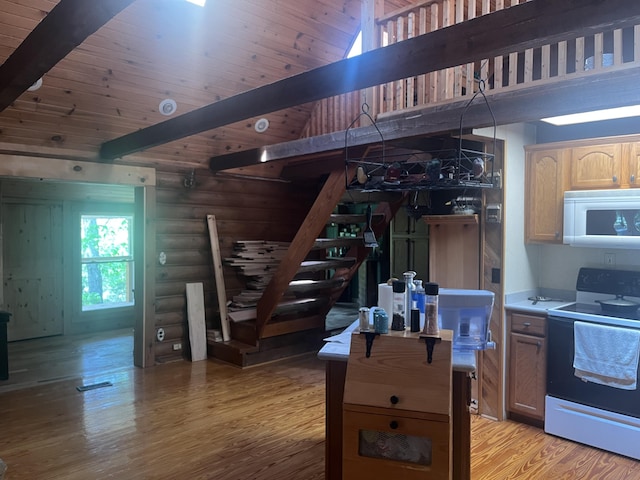 247 Hideaway, Owenton, KY 40359 - kitchen with white microwave, electric range, log walls, light wood finished floors, and high vaulted ceiling