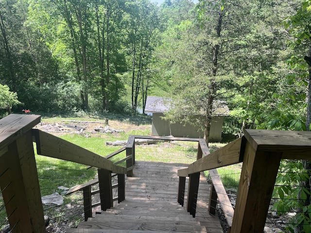 247 Hideaway, Owenton, KY 40359 - wooden terrace with a forest view and a shed