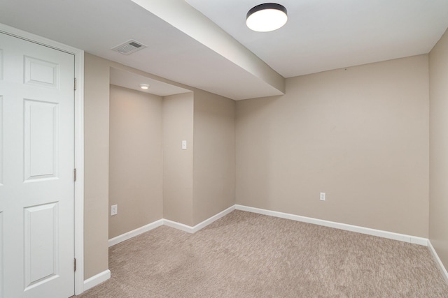 finished below grade area with light carpet and baseboards