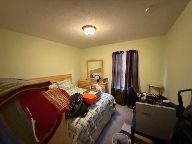 carpeted bedroom with a textured ceiling