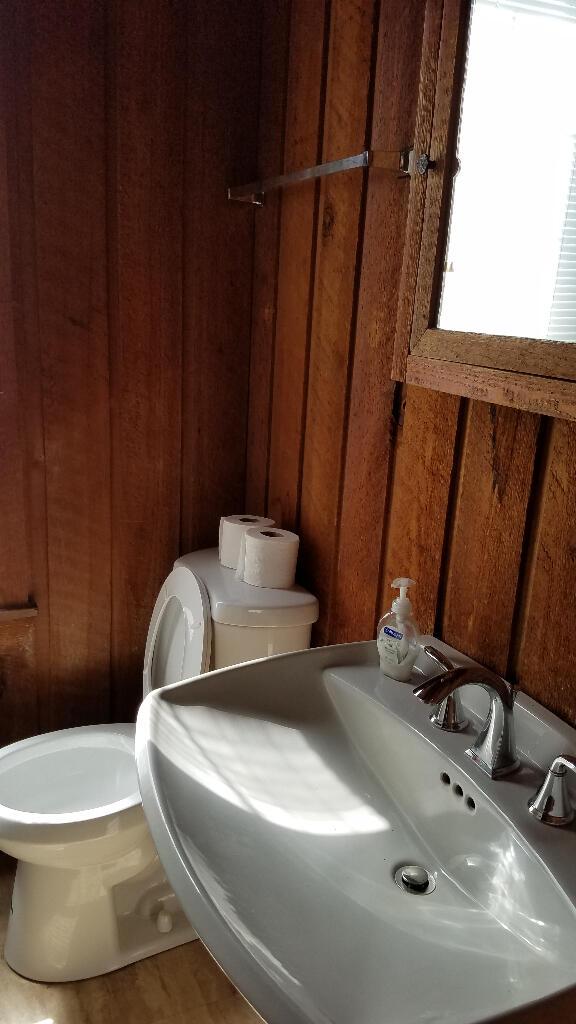 half bath featuring a sink and toilet
