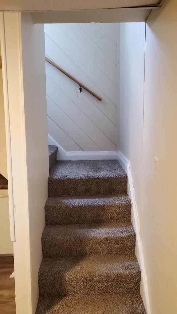 stairs featuring baseboards