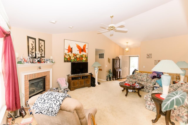 carpeted living room featuring lofted ceiling, ceiling fan, and a fireplace