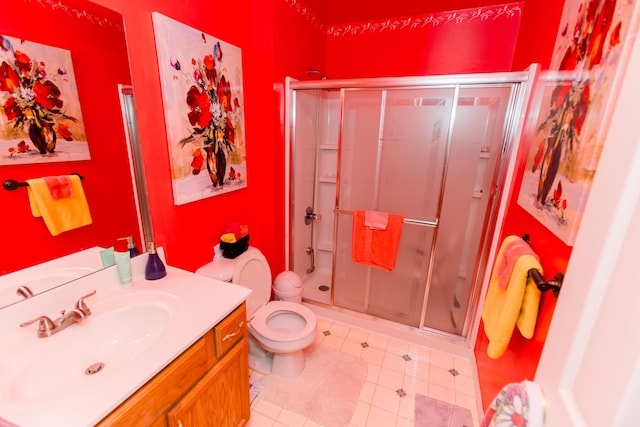 full bathroom with a shower stall, vanity, and toilet