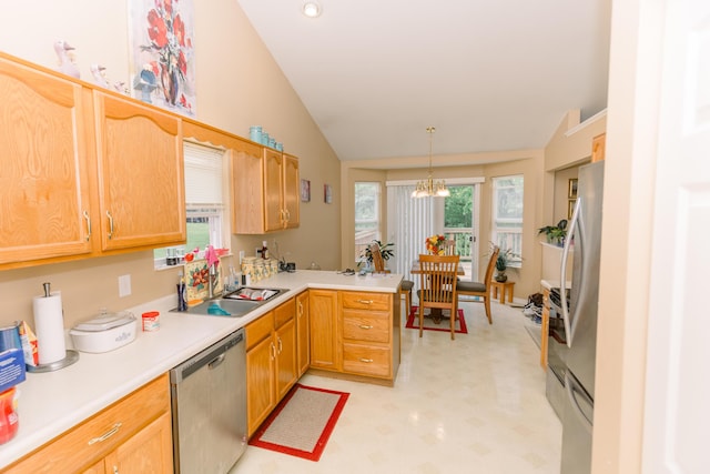 kitchen with stainless steel appliances, lofted ceiling, a peninsula, light flooring, and light countertops