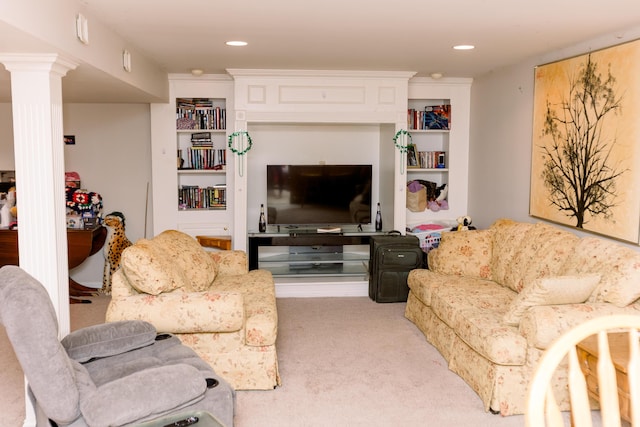 carpeted living area featuring decorative columns and recessed lighting