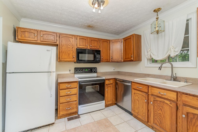 kitchen featuring freestanding refrigerator, electric range oven, black microwave, stainless steel dishwasher, and a sink