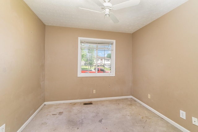carpeted empty room featuring baseboards, a textured ceiling, and ceiling fan