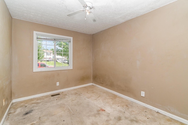 unfurnished room featuring baseboards, a textured ceiling, and a ceiling fan