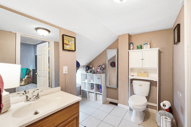 1706 Banklick St, Covington, KY 41011 - bathroom featuring tile patterned flooring, toilet, vaulted ceiling, vanity, and baseboards