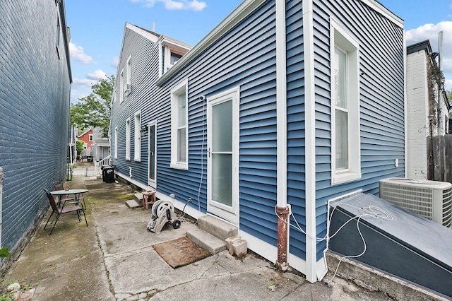 1706 Banklick St, Covington, KY 41011 - view of home's exterior with central air condition unit and a patio area