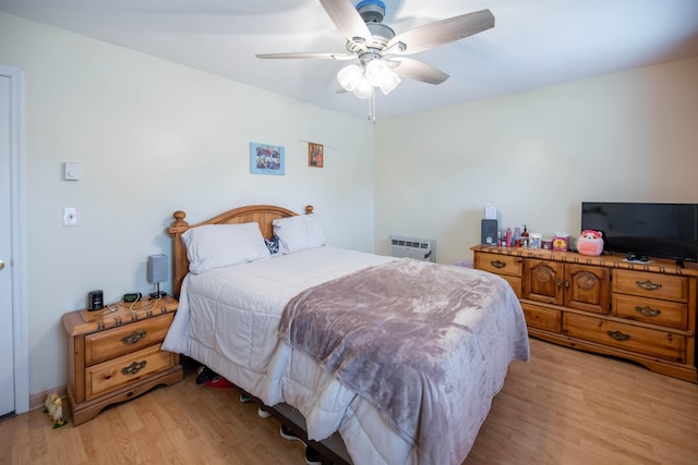 2220 Genevieve Ln, Covington, KY 41011 - bedroom with light wood finished floors, ceiling fan, and a wall mounted AC