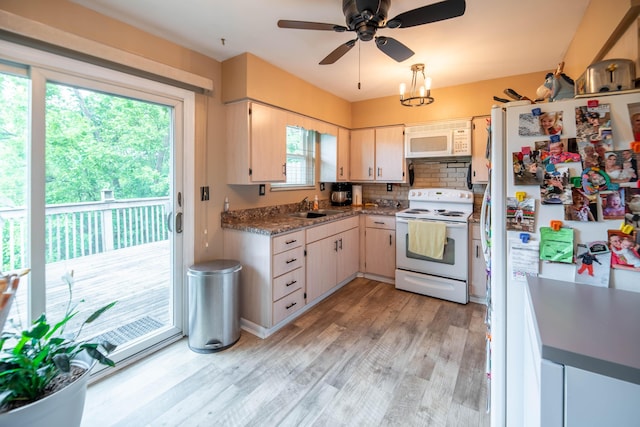 2220 Genevieve Ln, Covington, KY 41011 - kitchen featuring white appliances, a sink, light wood finished floors, a ceiling fan, and decorative backsplash