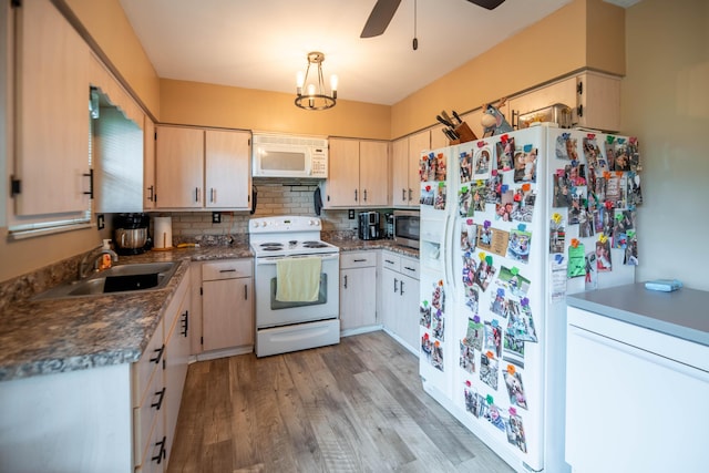 2220 Genevieve Ln, Covington, KY 41011 - kitchen with white appliances, light wood-style floors, tasteful backsplash, ceiling fan, and a sink
