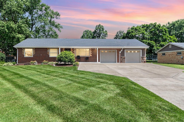 2534 Buttermilk Pike, Fort Mitchell, KY 41017 - ranch-style house featuring an attached garage, driveway, a front lawn, and brick siding