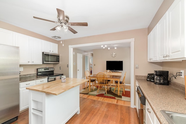 2534 Buttermilk Pike, Fort Mitchell, KY 41017 - kitchen featuring stainless steel appliances, butcher block countertops, a ceiling fan, and white cabinets
