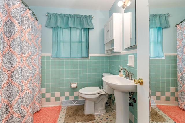 2534 Buttermilk Pike, Fort Mitchell, KY 41017 - bathroom featuring a wainscoted wall, tile walls, curtained shower, and tile patterned floors