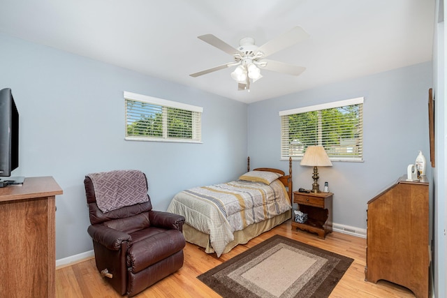 2534 Buttermilk Pike, Fort Mitchell, KY 41017 - bedroom with multiple windows, light wood-style floors, and ceiling fan