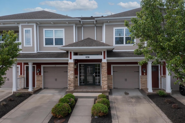 567 Riverpointe Dr Unit 11, Dayton, KY 41074 - view of property featuring concrete driveway and roof with shingles