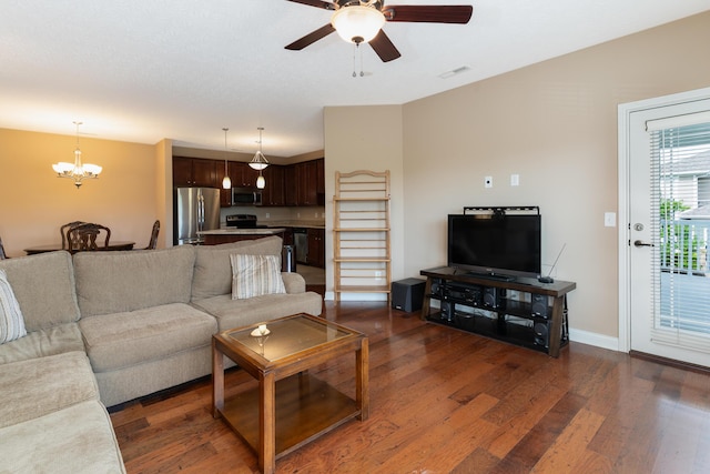 567 Riverpointe Dr Unit 11, Dayton, KY 41074 - living room featuring dark wood-style flooring, a chandelier, and ceiling fan