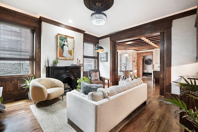 519 Greenup St Unit A, Covington, KY 41011 - living room with wood finished floors, a fireplace, ornamental molding, a chandelier, and baseboards