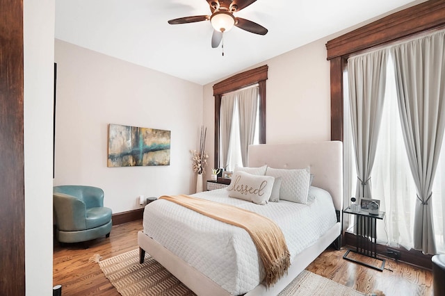 519 Greenup St Unit A, Covington, KY 41011 - bedroom with baseboards, wood finished floors, and a ceiling fan